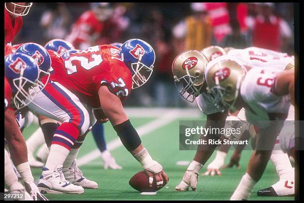 Center Keith Kartz of the Denver Broncos faces off against the defensive line and Michael Carter of the San Francisco 49ers during the Super Bowl...