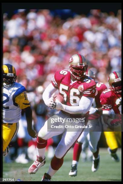 Defensive lineman Chris Doleman of the San Francisco 49ers moves down the field during a game against the St. Louis Rams at 3Com Park in San...