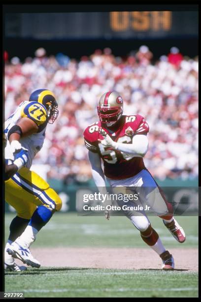 Defensive lineman Chris Doleman of the San Francisco 49ers rushes in during a game against the St. Louis Rams at 3Com Park in San Francisco,...