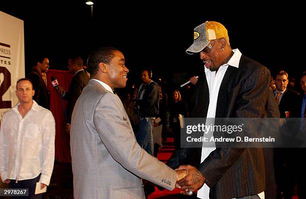 Isiah Thomas and Dennis Rodman catch up on old times during the American Express Celebrates the Rewarding Life of Earvin Johnson event on February...