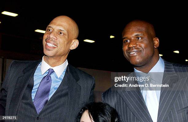 Kareem Abdul-Jabbar and Shaquille O'Neal pose for photos during the American Express Celebrates the Rewarding Life of Earvin Johnson event on...