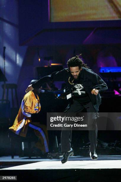 Savion Glover performs during the American Express Celebrates the Rewarding Life of Magic Johnson event on February 12, 2004 at the Shrine Auditorium...