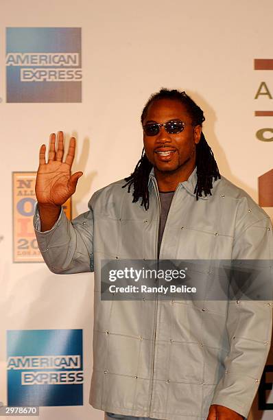 Former professional boxer Lennox Lewis acknowledges his fans and the media on the red carpet of the Shrine Auditorium as part of "American Express...