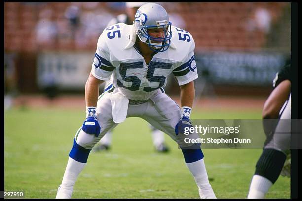 Linebacker Brian Bosworth of the Seattle Seahawks looks on during a game against the Los Angeles Raiders at the Los Angeles Memorial Coliseum in Los...