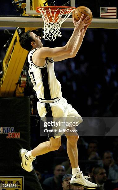 Sophomore Emanuel Ginobili of the San Antonio Spurs goes up for a dunk against the rookie team during the Got Milk? Rookie Challenge, part of the...