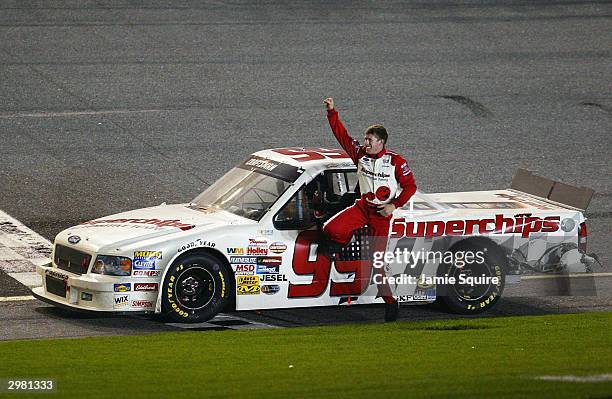 Carl Edwards, driver of the Superchips Ford, celebrates following his win in the NASCAR Craftsman Truck Series Florida Dodge Dealers 250, on February...