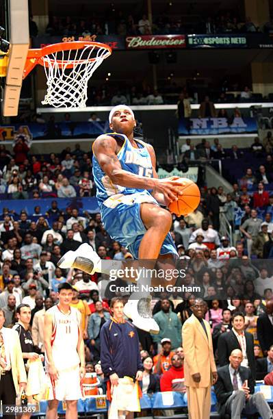 Carmelo Anthony of the Rookie Team slam dunks during the Got Milk? Rookie Challenge, part of the 53rd NBA All-Star weekend at Staples Center on...