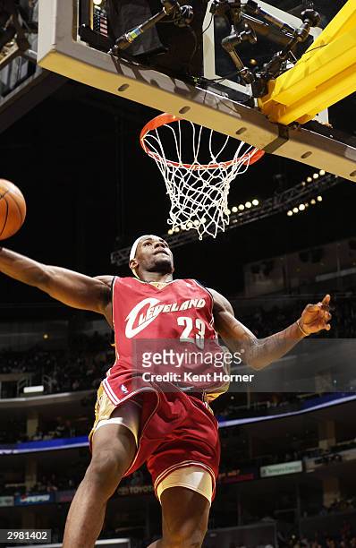 LeBron James drives to the basket for a dunk during the 2004 Got Milk? Rookie Challenge at the Staples Center, NBA All-Star Weekend on February 13,...