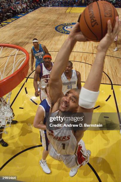 Carlos Boozer of the Sophomore Team drives to the basket for a dunk during the 2004 Got Milk? Rookie Challenge at the Staples Center, NBA All-Star...