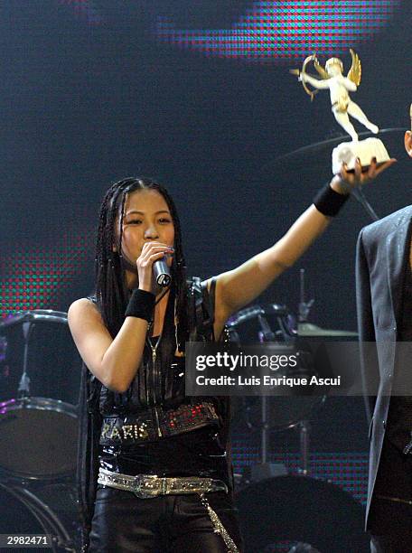 Korean artist BoA recieves her award on stage at the "MTV Asia Awards 2004" at the Singapore Indoor Stadium on February 14, 2004 in Singapore. The...