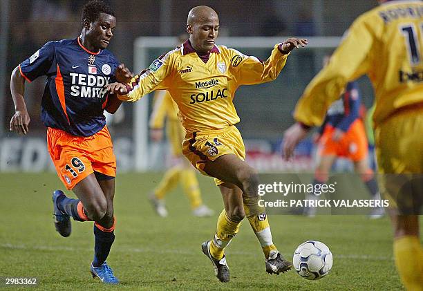 Metz's forward Toifilou Maoulida controls the ball in front of Montpellier's Valery Mezague during their French L1 soccer match, 14 February 2004 at...