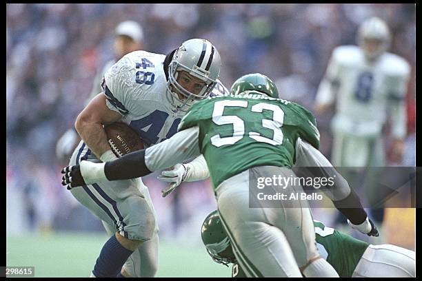 Linebacker Bill Romanowski of the Philadelphia Eagles looks to tackle Dallas Cowboys running back Daryl Johnston during a playoff game at Texas...