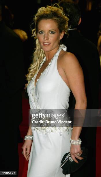 Davinia Taylor arrives at the "The Orange British Academy Film Awards" at the Odeon Leicester Square" on February 15, 2004 in London, wearing the...