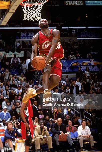 Freshman player LeBron James of the Cleveland Cavaliers goes for a reverse dunk against the Sophomore team during the Got Milk? Rookie Challenge, as...