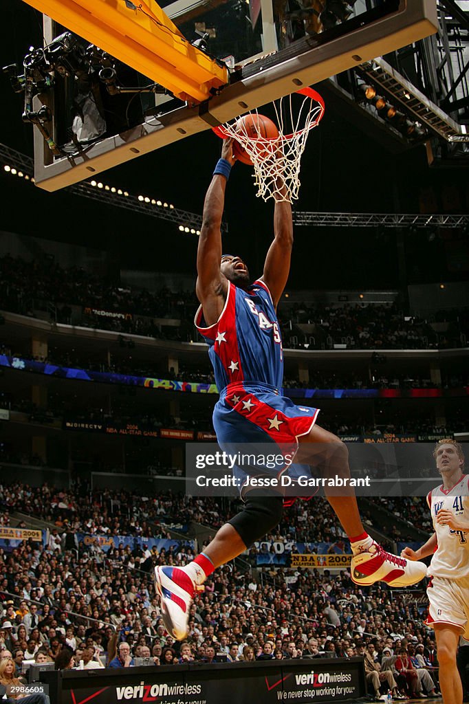 Baron Davis of the Eastern Conference All-Stars dunks against the ...