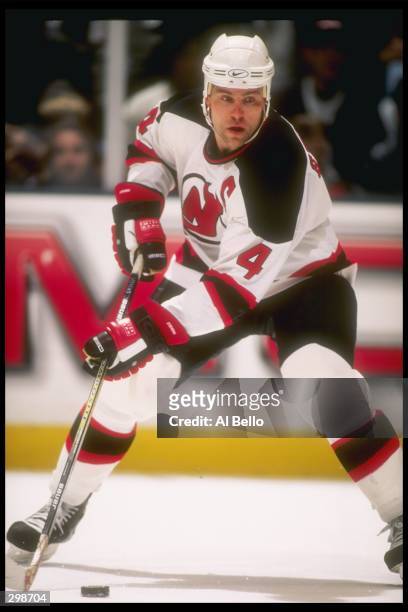 Defenseman Scott Stevens of the New Jersey Devils controls the puck during a game with the Colorado Avalanche at the Continental Airlines Arena in...