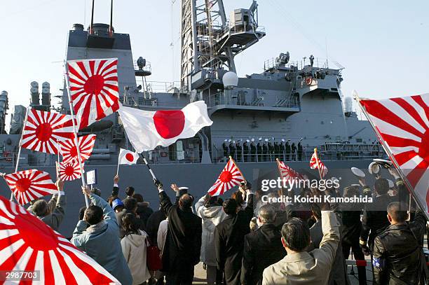 Families of the Japanese Self Defence Force see off the Japanese support vessel "Murasame" sailing to Muroran, Japan, on a mission to protect the...