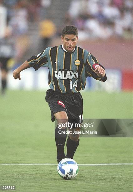 Chris Armas of the Los Angeles Galaxy dribbles the ball during their MLS game against the Columbus Crew at the Rose Bowl in Pasadena, California. The...