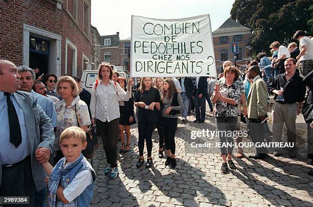 People demonstrate against Belgian government after the funeral ceremony of Melissa Russo and Julie Lejeune at Liege's Saint Martin Basilica, 22...