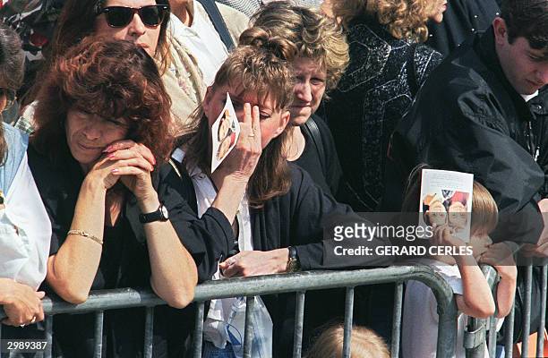 Some women cry during in front of Liege's Saint Martin Basilica during the funeral ceremony of Melissa Russo and Julie Lejeune, 22 August 1996. The...