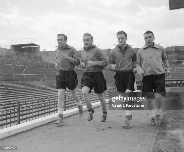 England players in training at Arsenal's Highbury ground in London, 11th April 1951. Left to right: Harold Hassall , Billy Wright , Tom Finney and...
