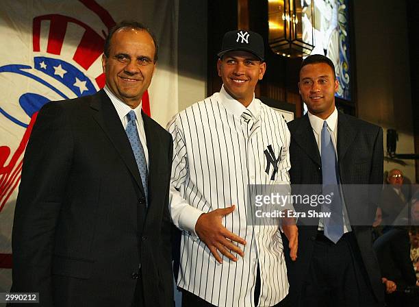Manager Joe Torre, Alex Rodriguez and Derek Jeter at a press conference that announced Rodriguez as the newest New York Yankee on February 17, 2004...
