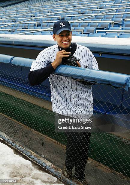 Alex Rodriguez stands in the Yankee dugout after a press conference that announced him as the newest New York Yankee on February 17, 2004 at Yankee...