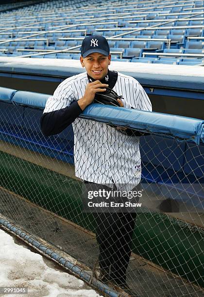 Alex Rodriguez stands in the Yankee dugout after a press conference that announced him as the newest New York Yankee on February 17, 2004 at Yankee...