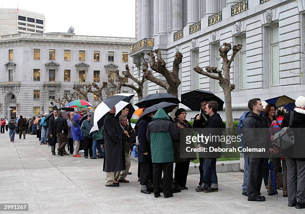 Gay couples wait in line in front of San Francisco City Hall for marriage licenses February 17, 2004 in San Francisco, California. San Francisco...