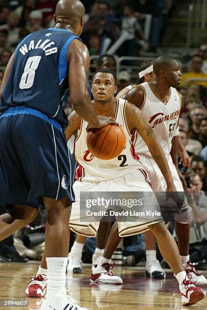 Dajuan Wagner of the Cleveland Cavaliers defends against Antoine Walker of the Dallas Mavericks February 18, 2004 at Gund Arena in Cleveland, Ohio....