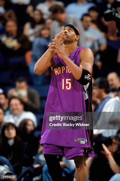 Vince Carter of the Toronto Raptors points to the sky during the NBA game against the Golden State Warriors at The Arena in Oakland on February 8,...