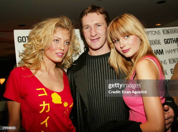 Hockey player Alex Kovalev poses with models Jennifer Ohlsson and Frida Anderson at the New York Knicks and New York Rangers party for the March...