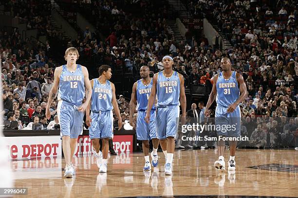 Chris Andersen, Andre Miller, Voshon Lenard, Carmelo Anthony and Nene of the Denver Nuggets walk upcourt during the game against the Portland Trail...