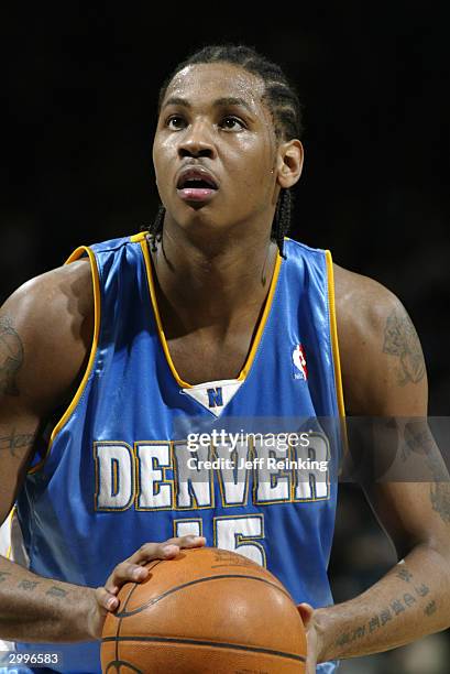 Carmelo Anthony of the Denver Nuggets shoots a free throw during the game against the Golden State Warriors at the Arena in Oakland on February 6,...