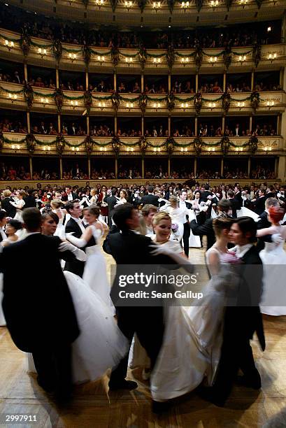 Debutantes and their escorts dance at the Vienna Opera Ball at the city's opera house February 19, 2004 in Vienna, Austria.