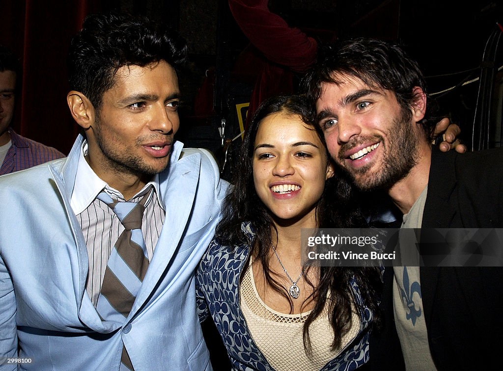 Latin singer Robi Rosa greets actress Michelle Rodriguez and actor ...