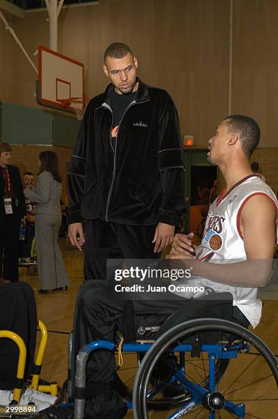 Former Portland Trail Blazer Tracy Murray listens to a participant as the National Wheelchair Basketball Association hosts a Wheelchair Basketball...