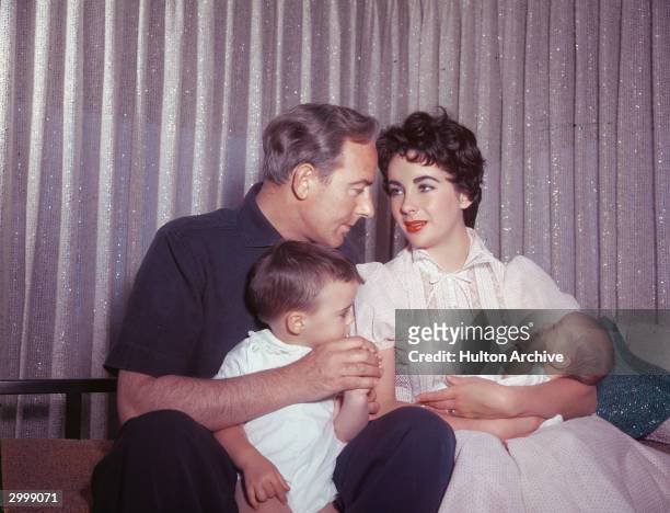 Actors Elizabeth Taylor and Michael Wilding with their sons Michael Jr and newborn Christopher, Los Angeles, California, 1955.