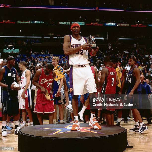 Amare Stoudemire of the Sophomore Team holds up the MVP trophy of the got milk? Rookie Game on February 13, 2004 at Staples Center in Los Angeles,...
