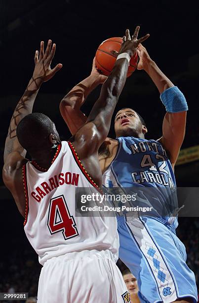 Sean May of the North Carolina Tar Heels shoots over Travis Garrison of the Maryland Terrapins during the game on January 14, 2004 at the Comcast...