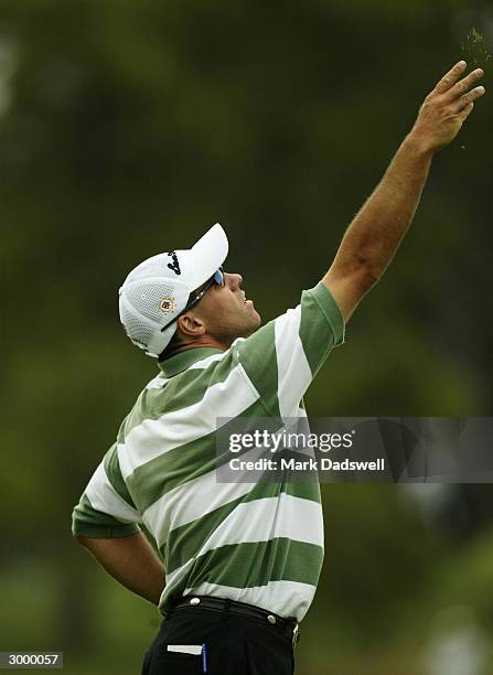 Andrew Tschudin of Australia tests the wind direction during day three of the Jacobs Creek Open at Kooyonga Golf Club February 21, 2004 in Adelaide,...