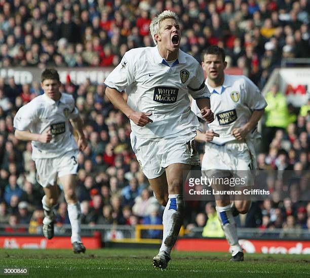 Alan Smith of Leeds celebrates after scoring the equalising goal during the FA Barclaycard Premiership match between Manchester United and Leeds...