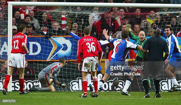 Brad Friedel of Blackburn Rovers is mobbed by his team mates after he scores their second goal during the FA Barclaycard Premiership match between...
