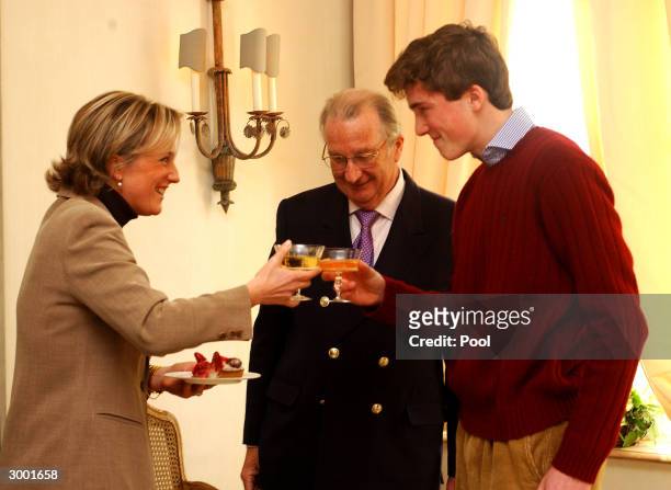 Prince Amedeo of Belgium toasts his birthday with King Albert and Queen Paola during a photocall to celebrate his 18th birthday on February 20, 2004...