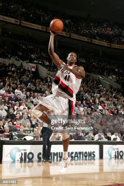 Theo Ratliff of the Portland Trail Blazers hooks the ball in during a game against the Boston Celtics on February 21, 2004 at the Rose Garden Arena...