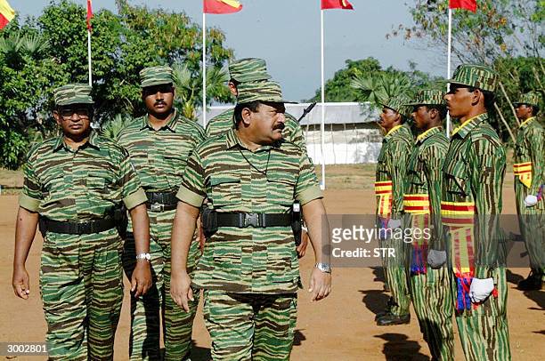 In this picture taken, 20 February 2004, Sri Lanka's top Tamil Tiger leader Velupillai Prabhakaran inspects the passing out parade of a new...