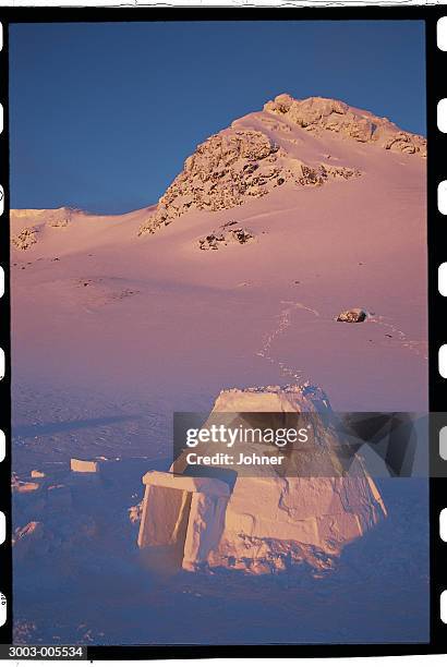 igloo and snowy mountain - igloo isolated stock pictures, royalty-free photos & images