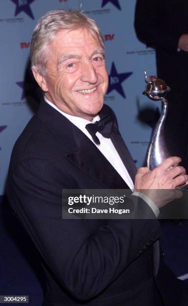 British television presenter Michael Parkinson arrives at the National Television Awards at the Royal Albert Hall on October 22, 2000 in London.