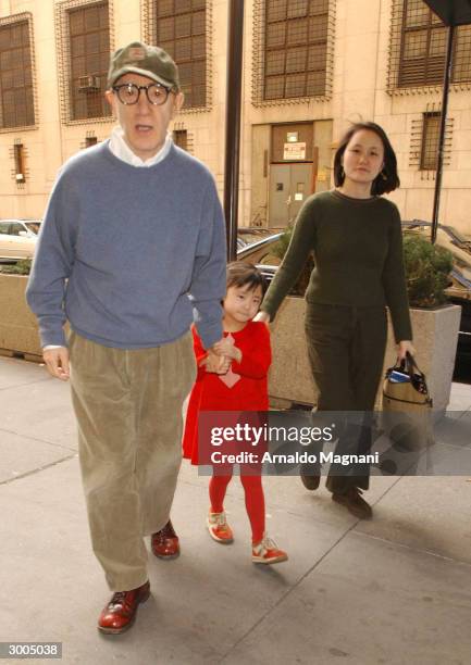 Director Woody Allen, daughter Bechet and wife, Soon-Yi Previn, walk towards Madison Square Garden to watch the Knicks take on the Cavaliers February...