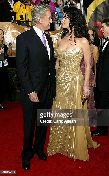 Actress Catherine Zeta-Jones and actor Michael Douglas attend the 10th Annual Screen Actors Guild Awards at the Shrine Auditorium on February 22,...